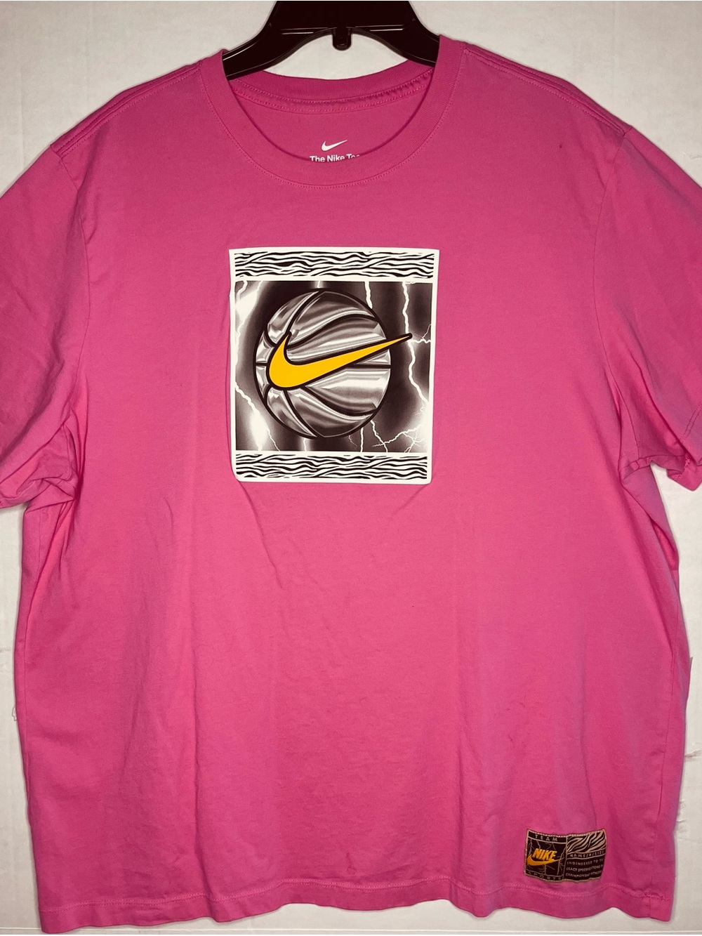 Nike Pink Short-Sleeve Graphic Tee with Yellow Swoosh